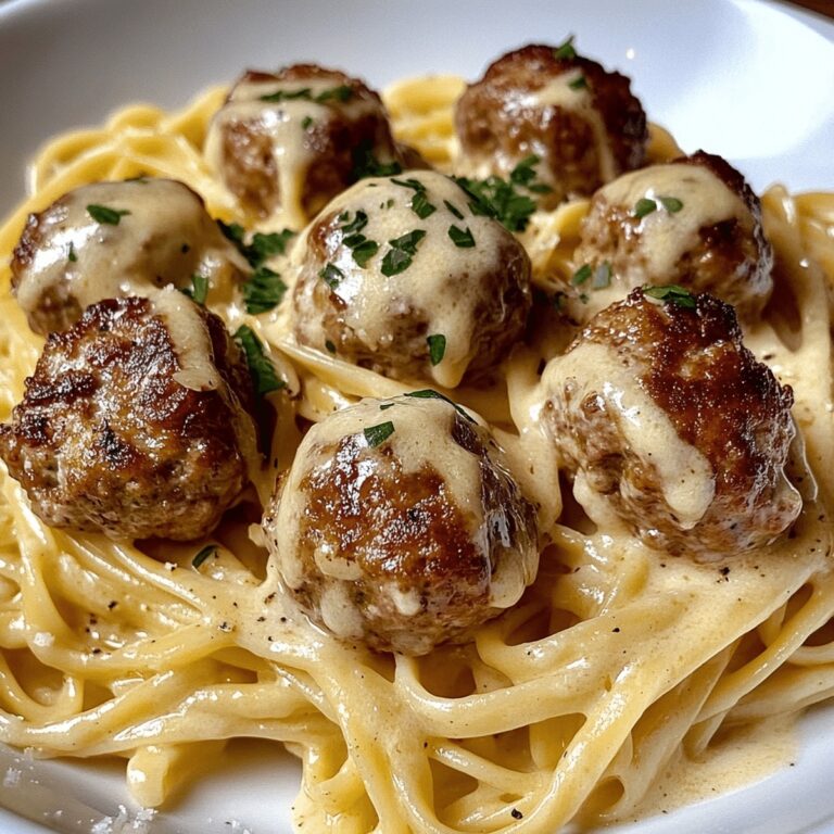 Easy Garlic Butter Meatballs Served Over Creamy Parmesan Linguine Recipe
